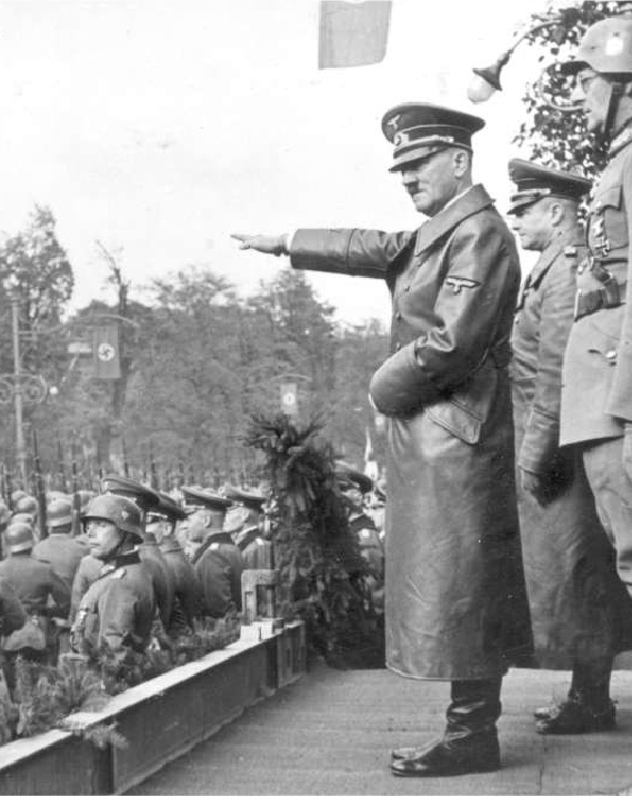 Adolf Hitler salutes triumphant German troops in Poland, October 1939.
